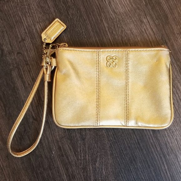 Coach Handbags - Coach Gold & Pink Wristlet w/ Logo Emblem & Tag